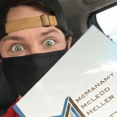 Brian holding the closing documents for his first rental